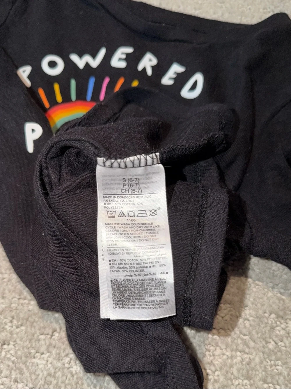 Kids “Powered by Positivity” Shirt Size S